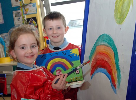 Eve Keegan and Charlie Reihill, Primary two pupils from St. Patrick's Mullnaskea, continues to practice their art even though their work is part of an exhibition by the Primary  one and two being held to raise funds for the school 