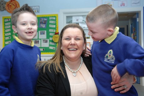 Bronagh Corrigan, teacher at  Holy Trinity, Primary School, Mill street site, who has won the Northern Ireland Primary School Teaching Award and will now go forward to the national final. She is pictured with two of her pupils Che Calgie and Conal Millar who were delighted to hear the news of the award gkfh44