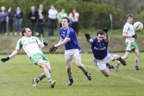 Paul McCusker hopes for a point as Niall Bogue clips the ball.  DP53