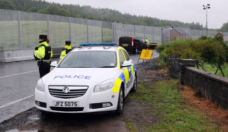 LOCKDOWN...PSNI staff and G4 Security staff on duty at the fence surrounding the G8 summit venue