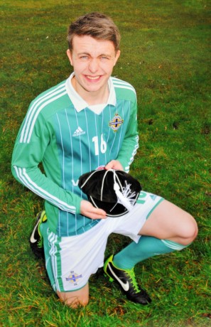 Josh McIlwaine (pictured) with his Northern Ireland Schoolboy International cap