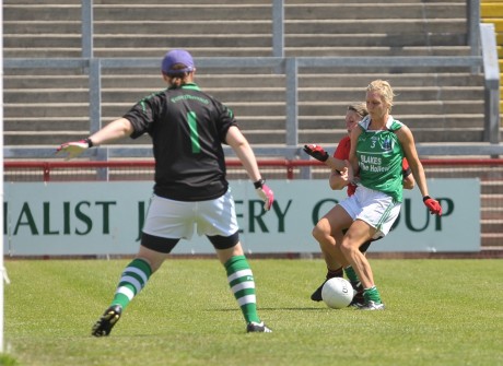 Kyla McManus shields the ball from the Down girl. 