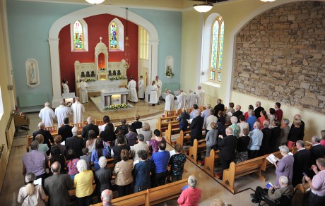 The congeration gathers to hear Bishop Liam McDaid during the reconsecration 