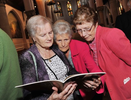 Enjoying the newly-launched book "Age to Age" celebrating the history of the St Michael's Church Choir are Pauline Kelly, Eilish Entwhistle and Noreen McCluskey 
