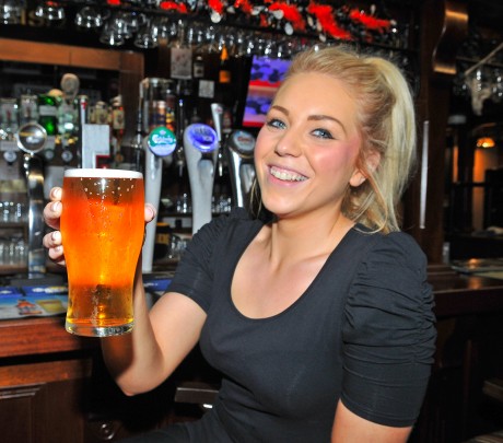 Stephanie Mallon, assistant manager of the Devenish bar in Enniskillen, with a pint of Devenish beer which is on draught 