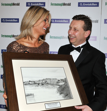 John Maguire of the Belleek Group, pictured with his wife Catherine, after being presented with the Fermanagh Herald and 02 Enniskillen Business Person of the Year Award