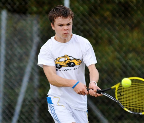 BACKHAND...Jared Monaghan with a strong double-handed backhand during the Under 18 Boys Final