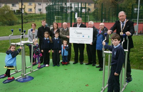 Pictured with local children at the official opening of the Multi-Use Games Area and Outdoor Gym in Newtownbutler are from left to right: Carol Follis, Groundwork NI; Christopher Spence, FRCN; Linda McQueen, SWARD; Bert Johnson, Newtownbutler Together; Cllr. Paul Robinson; Drew Robinson, SWARD; Cllr. Thomas O'Reilly; Cllr. Alex Baird, Chairman of Fermanagh District Council 