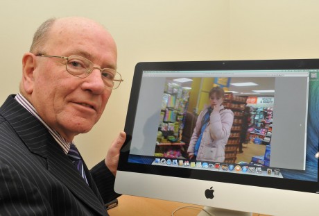 Bernard O'Connor looking at a picture of his daughter gkfh50