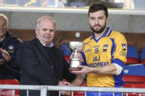 Ryan McCluskey accepts the winning trophy from Patsy Dolan.  DP83