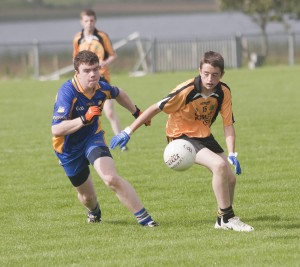 Ethan Webb and Enniskillen Gaels Conor Millar race for the loose ball