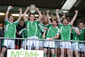 Roslea captain James Sherry and his team mates celebrate as they lift the cup at Brewster Park