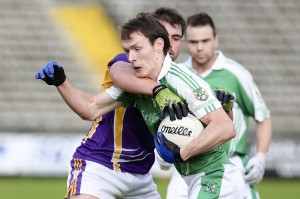 James Sherry pushes past Maurice Cassidy during the league final