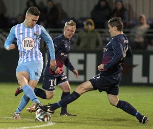 Conor McDonald and Ballinamallard's James McKenna clash during Friday night's Danske Bank Premiership match at Milltown.