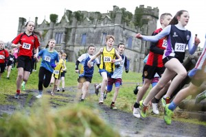 The U13 boys and girls begin their run in front of Necarne Castle.
