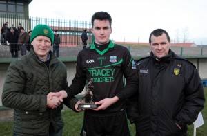 Conor McMahon, Bank of Ireland, Enniskillen presents the man of the match award to Fermanagh goalkeeper Thomas Treacy after the Dr. McKenna group game against Donegal in Fr. Tierney Park, Ballyshannon on Sunday. Also pictured is Sean Dunnion, chairman of the Donegal County Board