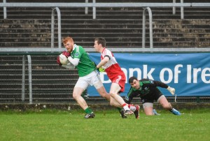Fermanagh's James Allen, deals with the pressure near his team’s goal.