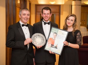 Mark Hoy, centre, celebrates winning Overall Sports Personality with his coach Mark Connolly and his girlfriend Grace Boyd.