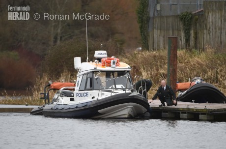 Police moor their boat near Riverside in Enniskillen this afternoon.