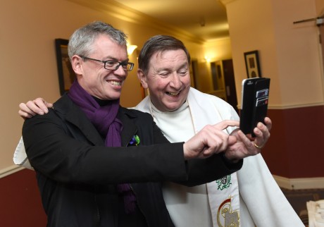 Joe Brolly takes a 'selfie' with Fr Brian D'Arcy at Monday evening's packed out Novena of Hope at the Graan 