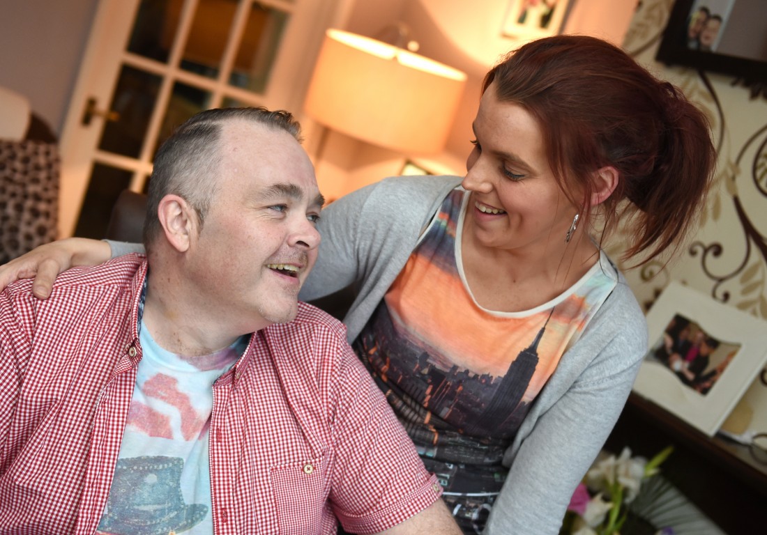 Anthony McBrien, in relaxed mood at home, shares a joke with his partner Lisa Cassidy who has helped him with his recovery    RMGFH163