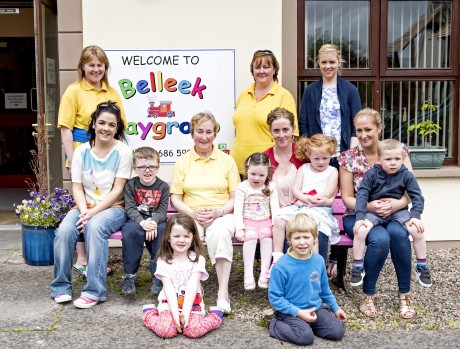 Retiring playgroup leader Edith McBride with two of the staff members and a few of the last parents and children to benefit from her years of nurturing experience.