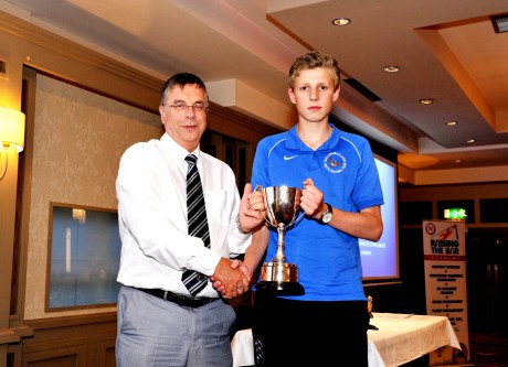 Luke Henderson, right, receives the Greg Turley cup from Ballinamallard United Vice Chairman, Noel Fallis.