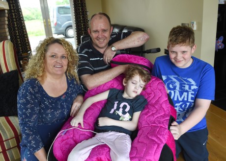 Little Ellie Nicholl's family have been overwhelmed at the support they have received online recently.  Pictured with Ellie, centre, are mum Ciara, dad Billy and big brother Arran    RMGFH86