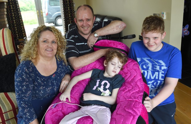 Little Ellie Nicholl's family have been overwhelmed at the support they have received online recently.  Pictured with Ellie, centre, are mum Ciara, dad Billy and big brother Arran    RMGFH86