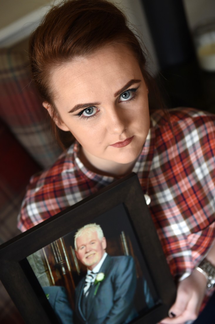 Shannon Sheerin holds a picture of her beloved late grandfather, Gerry, whose jewellery was stolen by callous thieves when their home was burgled recently    Picture: Ronan McGrade