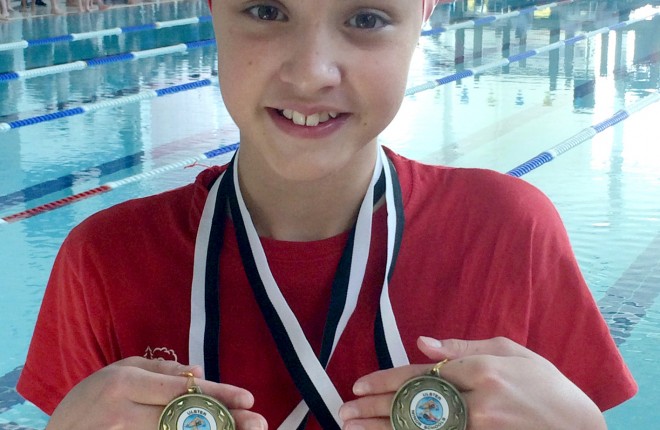 Caragh Leonard with the two golds she picked up at the Ulster Minor Schools Swim Championships.