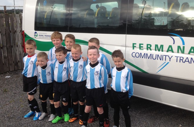 The Lisbellaw United Youth team beside a Fermanagh Community Transport bus