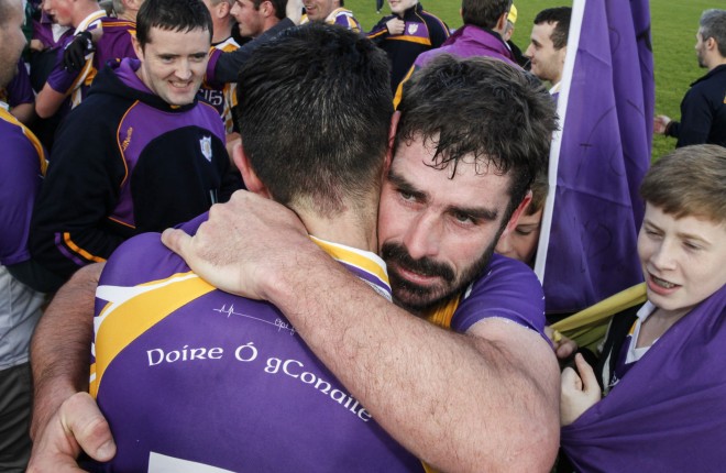 Declan Cassidy embracing Garvan McGinley after Derrygonnelly's SFC win.
