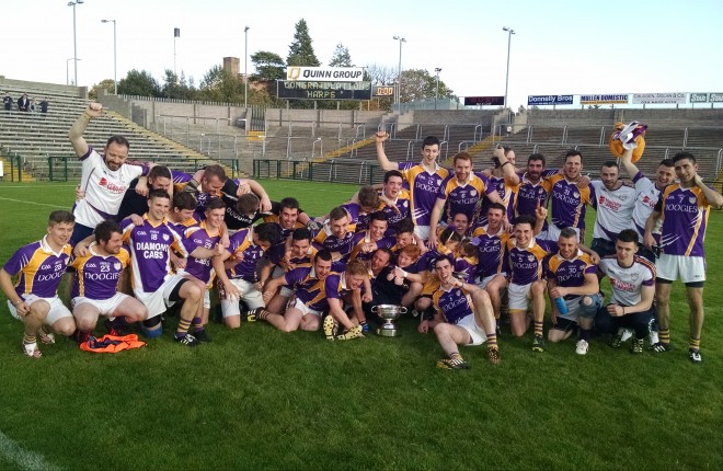 Derrygonnelly celebrate on a sun-soaked Brewster Park after capturing the county title. 