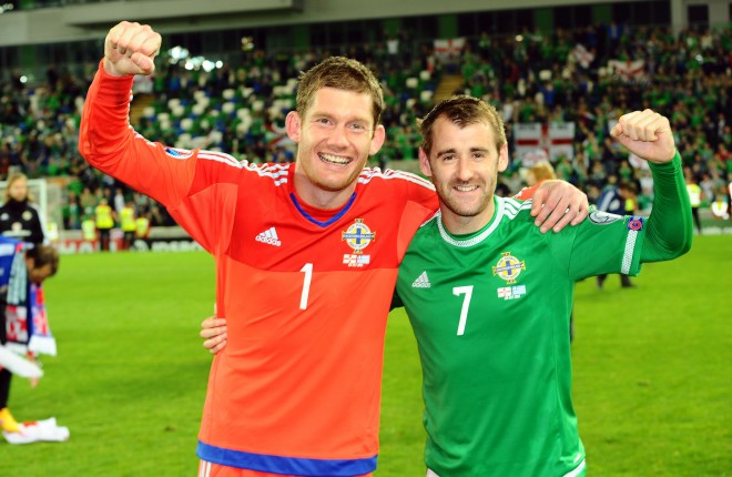 Northern Ireland's Michael McGovern and Niall McGinn celebrate the team's victory against Greece.