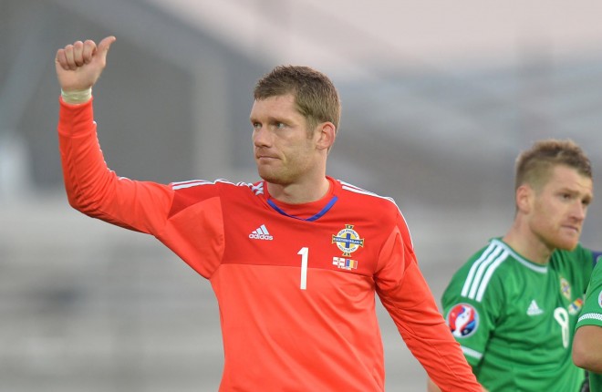 Michael McGovern salutes the fans after Northern Ireland secured Euro 2016 qualification.