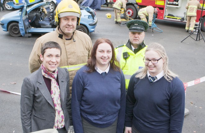 Road safety demo at Devenish College, Crew Commander Liam Hanna, Constable Alan Palmer, Teacher Ms Anne Bullock and pupils Rachel West and Chloe Crawford who took part in the simulated rescue.  bmcb 55