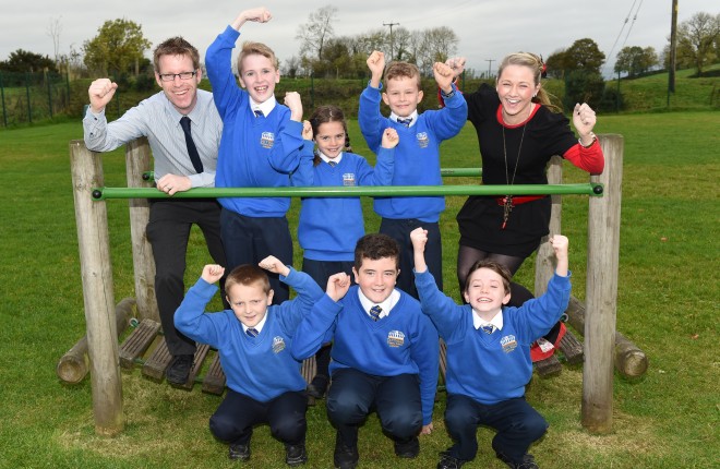 Tattygar Primary School, Lisbellaw, were recently received £4,000 from the DOE's Challenge Fund.  Delighted staff and pupils plan to build a poly tunnel and develop other environmental projects within the school.  Back from left, John Prunty (Principal), Joe Doherty, Ellen Moore, Ryan Hannigan and Aideen McGarrigle (Teacher).  Front, Conan McPhillips, Ryan Gilleece and Eoghan Callaghan    RMG02