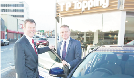 Hamish Logan Customer service man- ager with franchise manager Adrian De- vitt at TP Toppings