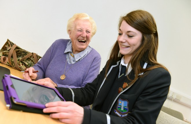 88 year old Margaret Thomas proves it's never too late to learn as she enjoys her lessons on how to use an iPad with Susan Surphlis, Head Girl at Devenish College    RMG15