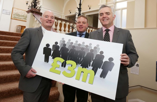 15 February 16 - Picture by Darren Kidd / Press Eye.   Enterprise Trade and Investment Minister, Jonathan Bell, has announced a combined investment of over £3million by 17 Fermanagh and Omagh based businesses, which include plans to create 74 new jobs The investments which will contribute over £1.5 million in annual salaries to the local economy are supported by Invest Northern Ireland and build on its current support to companies in the Fermanagh & Omagh District Council area.  Pictured with the Minister at the announcement in Enniskillen Town Hall, are Colm MacRory from Spires Gallery in Omagh and Jason McElwaine from McElwaine Security Services in Lisnaskea, both of who will be recruiting new staff.