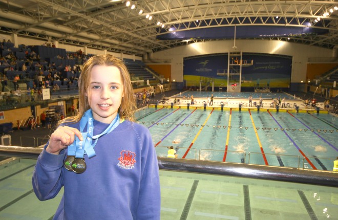 Ellie McCartney with the two golds she collected at the Irish Minor Schools Championships.