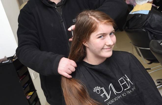 Hannah Armstrong gets a hair trim by her mother Katrina ahead of getting her hair shaved off to raise money for charity on Friday 4th March    RMG121