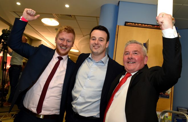 Daniel McCrossan and Ritchie McPhilips with SDLP Party leader Colum Eastwood, celebrates at the Omagh count. MC 7  Picture Michael Cullen