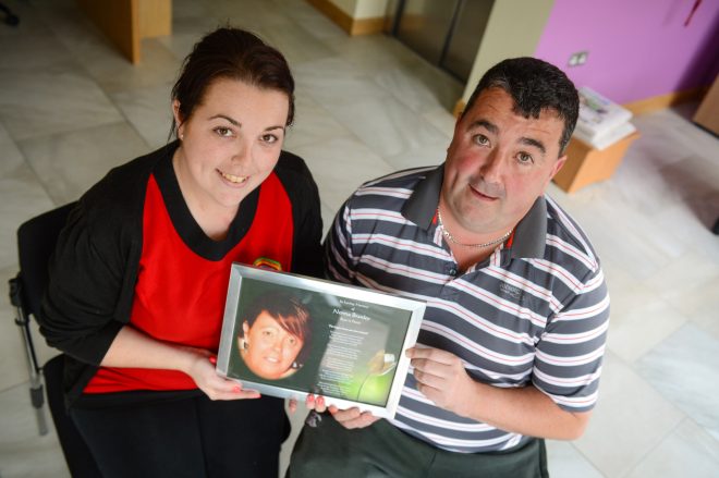 Ciara and Malcolm Branley with a photo of their mum, Norma    RMG23