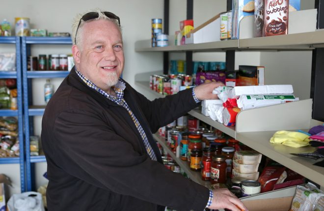 John Shades keeps the shelves stacked at the Enniskillen Food Bank.  RMGFH53