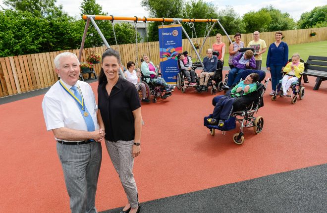 Ken Rainey (President of the Rotary Club of Enniskillen 2015/16) with Patricia Griffith (Day Care Services Manager, Killadeas Day Centre) with staff and service users at the new garden and play area at Killadeas Day Centre, Lackaghboy 2    RMG04