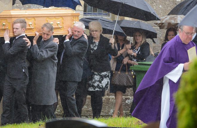 Mourners carry the coffin of Pat McIntyre at the Derrygonnelly man's funeral