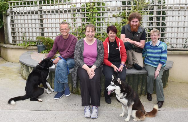 Staff members and volunteers take a break in the memorial garden that houses founder Pat Nolan's ashes.  From left, Simon Bryant, Teresa Maguire, Sheena Moffitt, Conor Kelly and Mavis Sullivan    RMG38