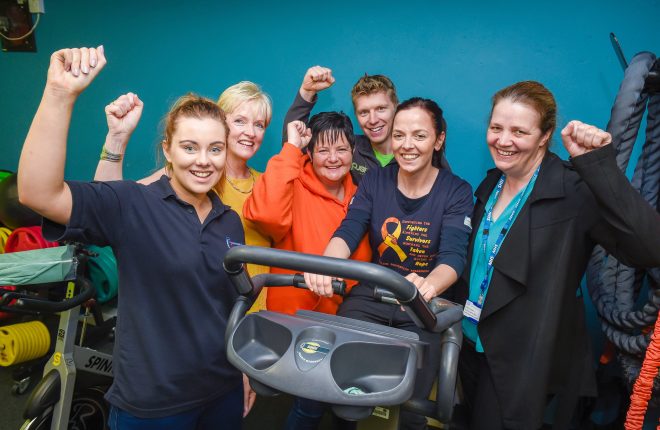 Cheering on Ciara Balfour (Community Family Support Programme) in the Cycle Against Suicide on the spinning machine at Push Fitness are, from left, Stacey Lynch (FIND), Colette Cullen (Suicide Liason Officer for Western Trust), Jo Little (Cycle Against Suicide), Richard Linton (Push Fitness), Fidelis Simpson (Suicide Liason Officer for Western Trust)    RMG07